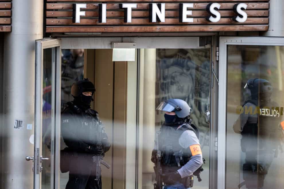 Armed police officers at the scene of a stabbing attack in a health club in Duisburg, Germany (Christoph Reichwein/dpa via AP)