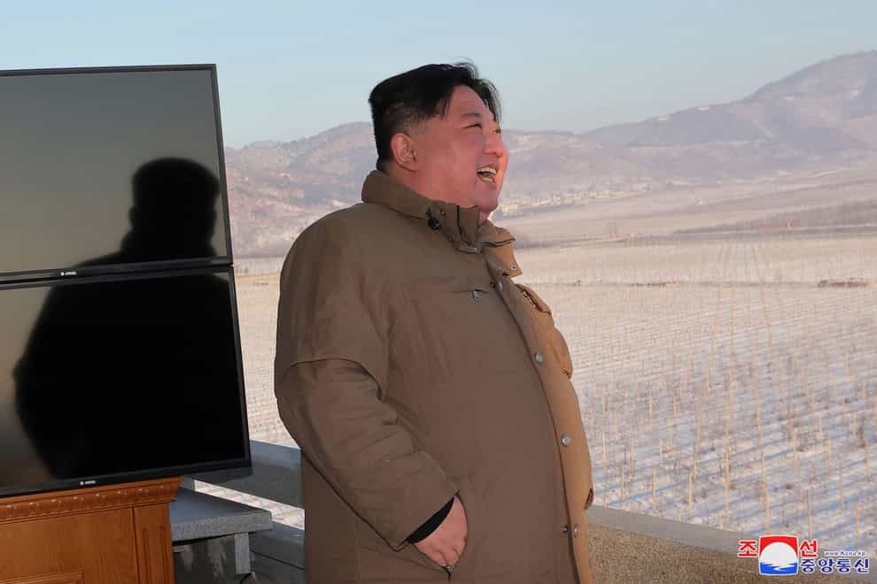 North Korean leader Kim Jong Un watches a test launch of what it says is an intercontinental ballistic missile from an undisclosed location in North Korea (Korean Central News Agency/Korea News Service via AP)