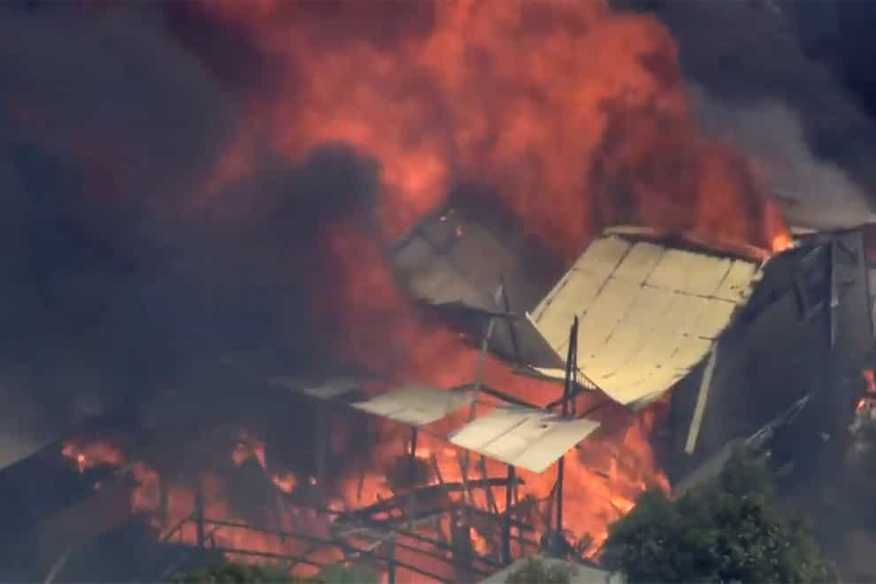 A home engulfed in flames outside Perth, Australia, as a wildfire burned out of control (Australian Broadcasting Corp/Channel 7/Channel 9 via AP)