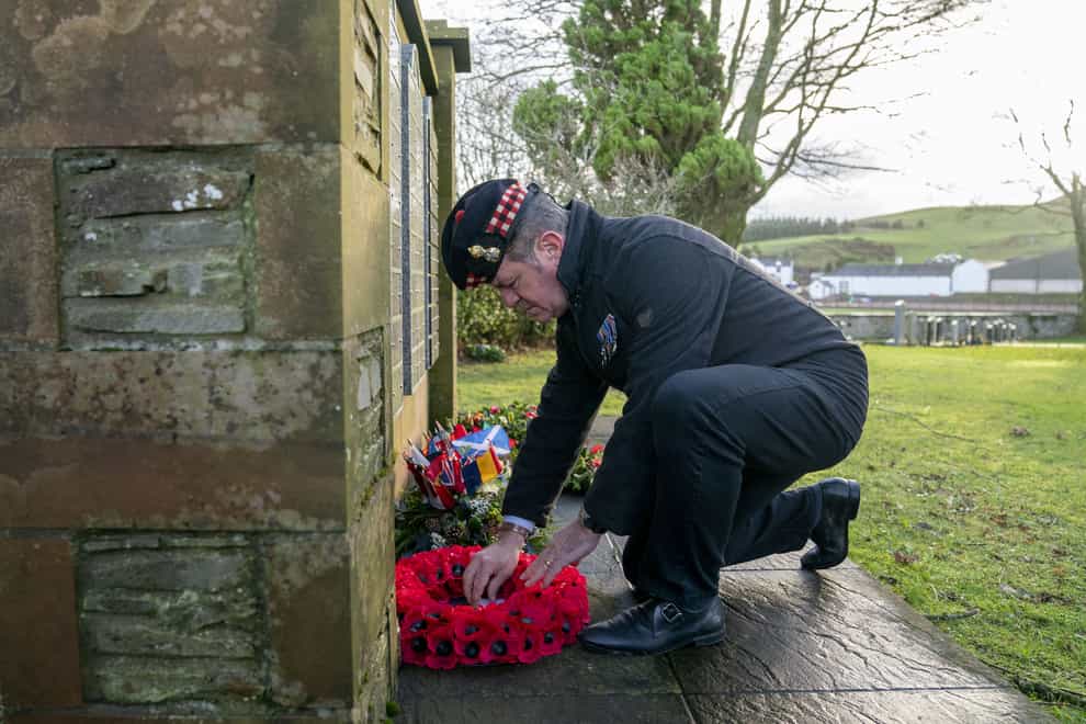 People lay wreaths before a remembrance service at Tundergarth Church to mark the 35th anniversary of the Lockerbie bombing (Jane Barlow/PA)
