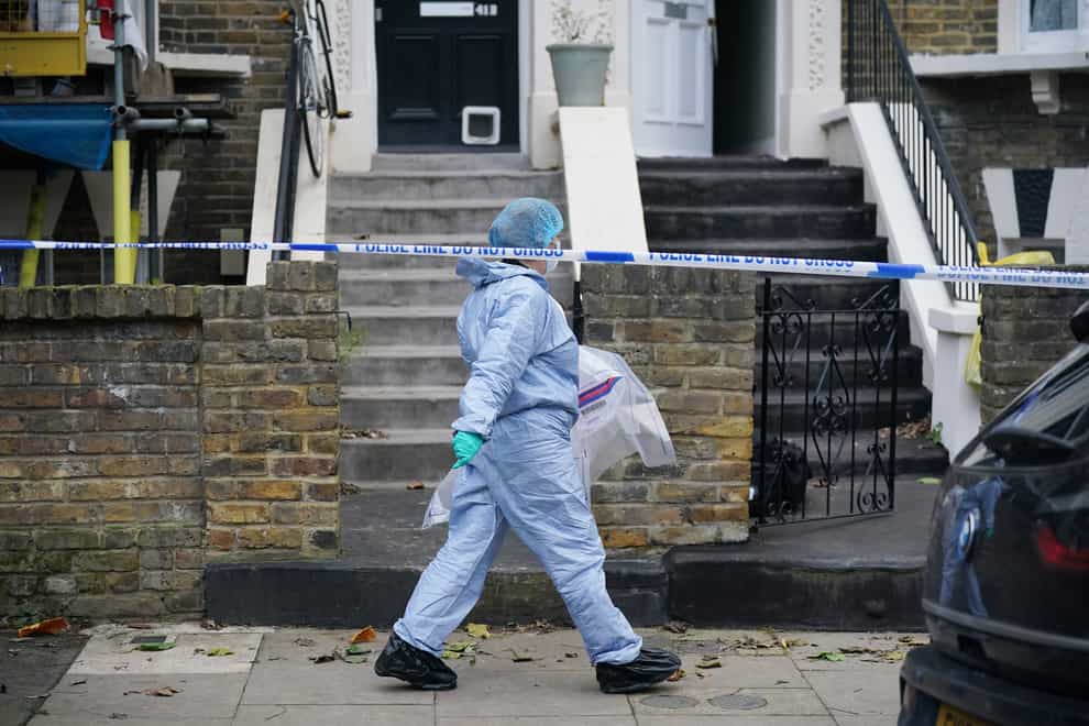Forensic officers at a property on Montague Road in Dalston, east London, where a four-year-old boy has died after suffering knife injuries (Yui Mok/PA)