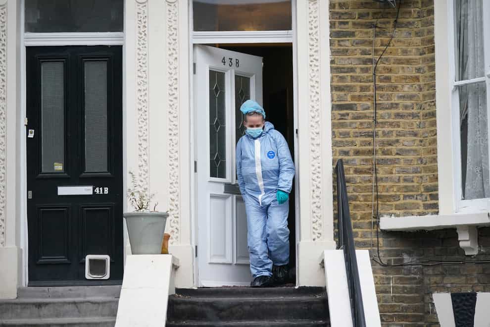 Forensic officers at a property on Montague Road in east London (Yui Mok/PA)