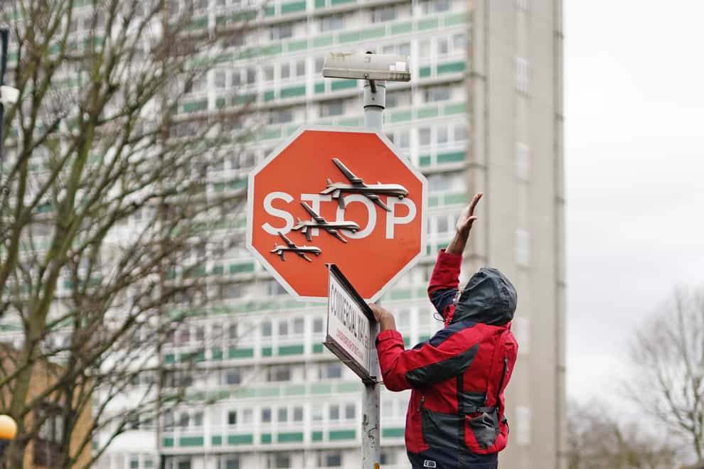 A piece of artwork by Banksy, which shows what looks like three drones on a traffic stop sign, was removed in Peckham (Aaron Chown/PA)