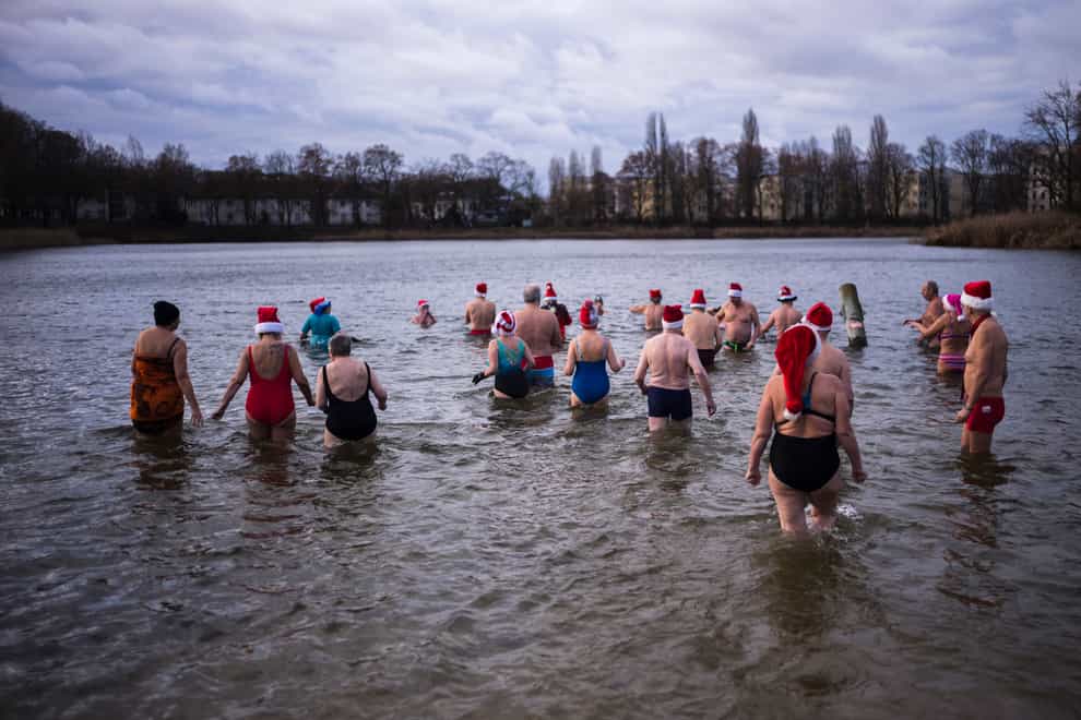 Traditional Christmas Day swimmers at the Orankesee lake in Berlin, Germany (Markus Schreiber/AP)