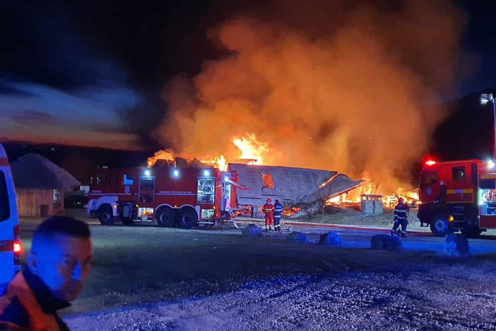 A guesthouse burns in Tohani, Romania (Romanian Emergency Services – ISU Prahova via AP)