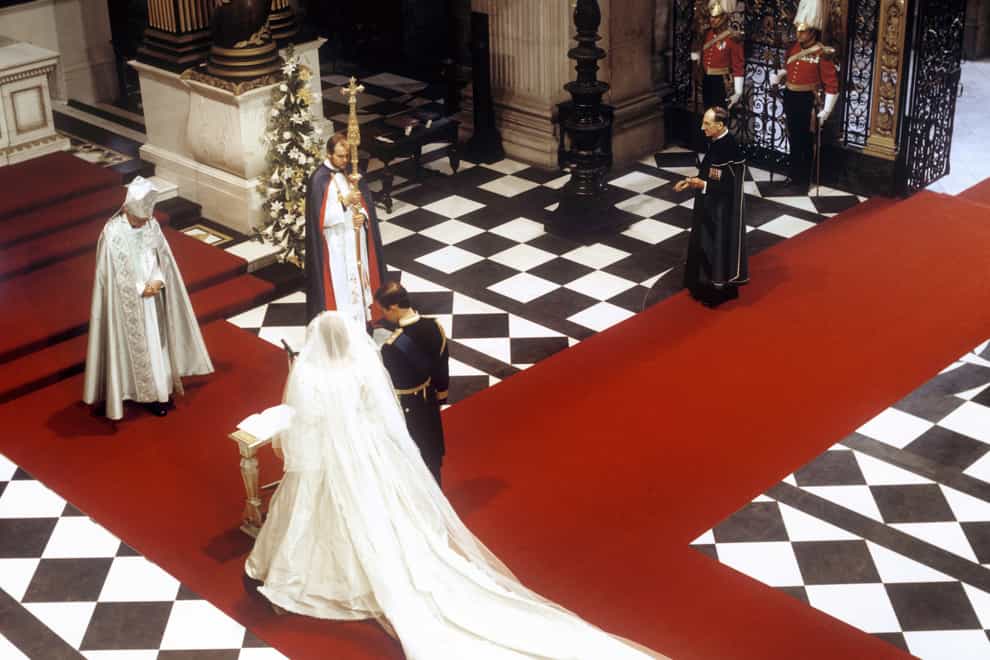The Prince and Princess of Wales at the High Altar in front of the Archbishop of Canterbury, Robert Runcie, during their wedding at St Paul’s Cathedral (PA)