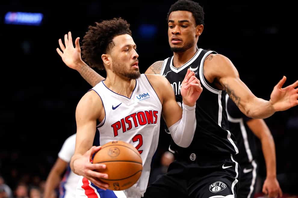 Detroit Pistons guard Cade Cunningham drives to the basket against Brooklyn Nets centre Nic Claxton (Noah K Murray/AP)