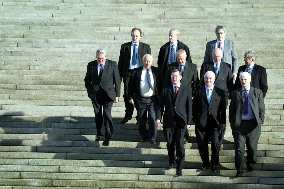 Ulster Unionist Leader David Trimble (front left) with colleagues at Stormont, where the party unveiled the new “Simply British” logo. Trimble said at the launch of a party billboard campaign that the Government would have to think carefully about the reasons for a pre-Christmas Assembly election. Surrounded by some of his Assembly colleagues, including former economy minister Sir Reg Empey, the Upper Bann MP said: If he was minded to call an election, what he would have to do is to explain to us how the Assembly is going to function?