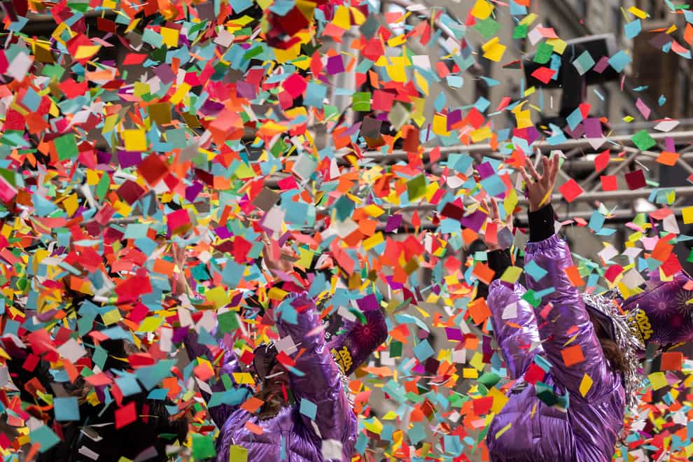 Times Square was filled with confetti in a test ahead of New Year’s Eve (Yuki Iwamura/AP)