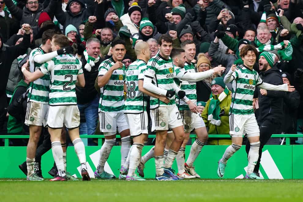 Celtic’s Kyogo Furuhashi celebrates with his team-mates after scoring their side’s second goal (Jane Barlow/PA)