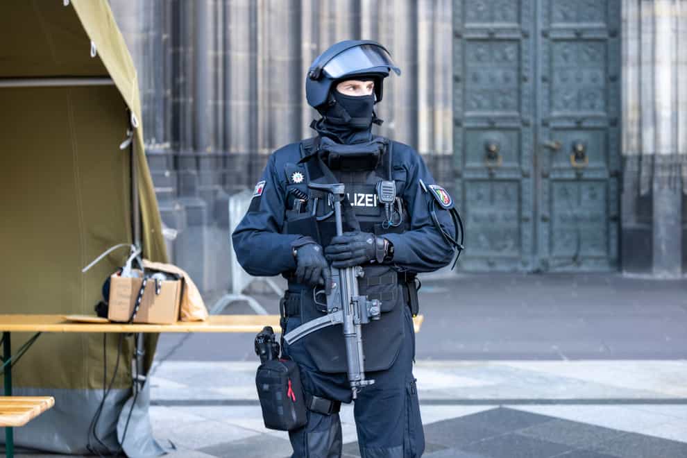 Armed police outside Cologne Cathedral (Thomas Banneyer/dpa via AP)