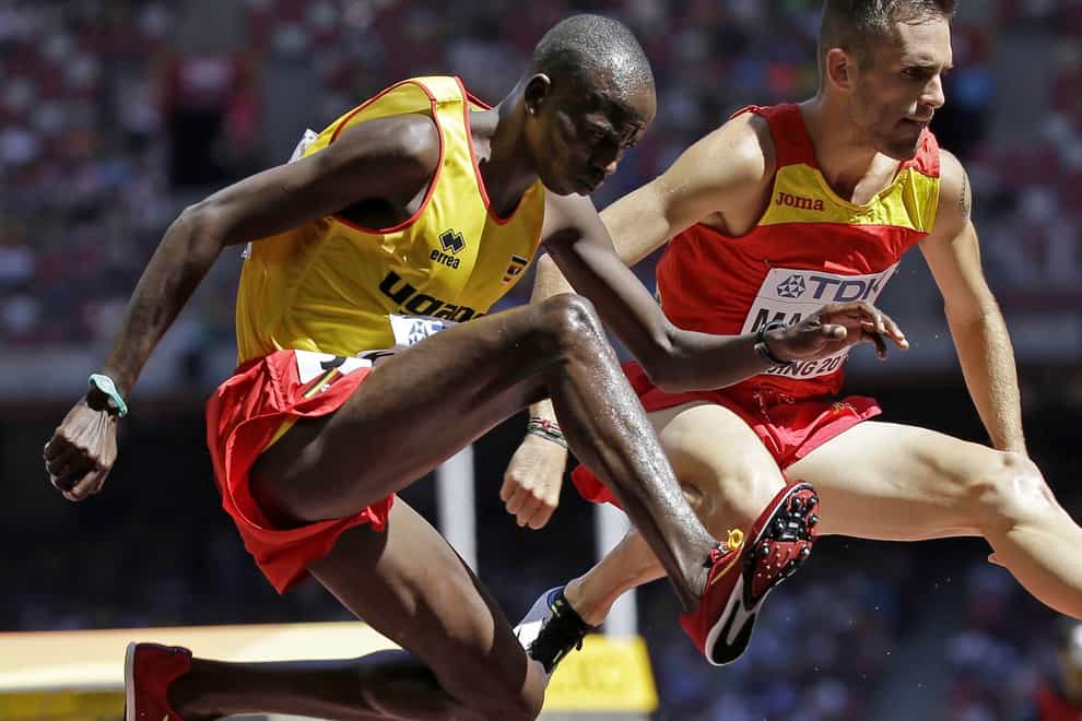 Uganda’s Benjamin Kiplagat, front, competes in round one of the men’s 3000m steeplechase during the World Athletic Championships at the Bird’s Nest stadium in Beijing, in August 2015 (David J Phillip/AP)