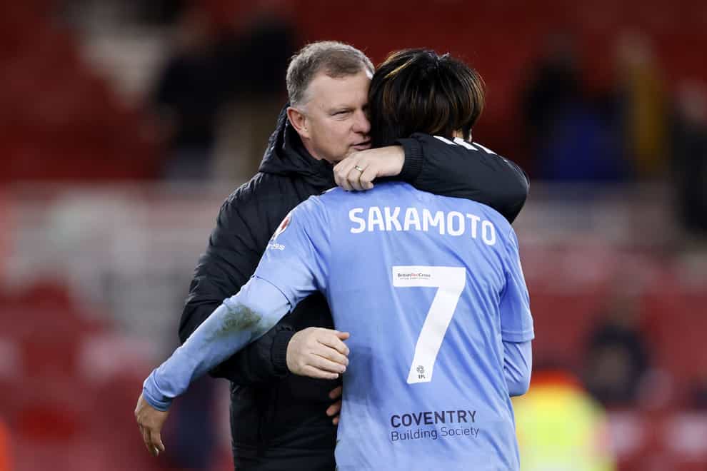Coventry manager Mark Robins greets two-goal hero Tatsuhiro Sakamoto (Richard Sellers/PA)