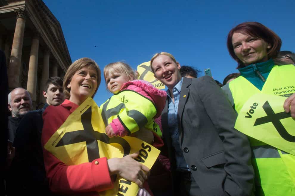 Nicola Sturgeon with Mhairi Black on the campaign trail in Paisley ahead of the 2015 general election (Danny Lawson/PA)