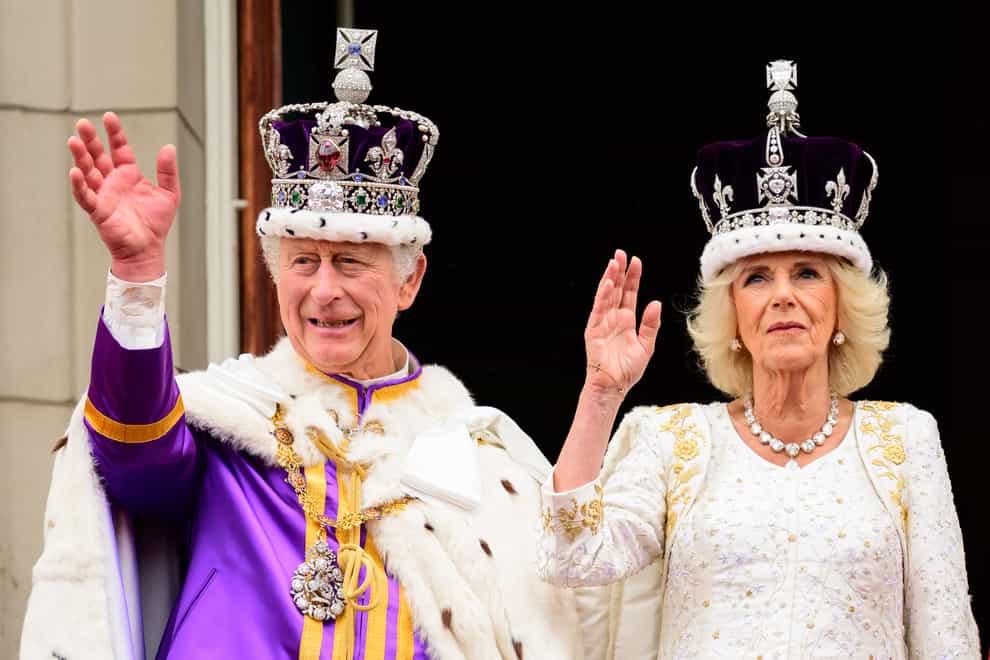 The King and Queen on the balcony of Buckingham Palace after the coronation (Leon Neal/PA)