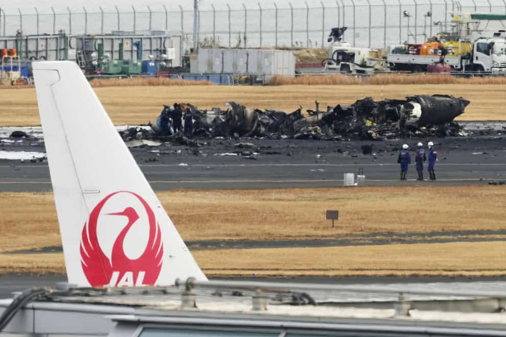 Transport officials and police have begun on-site investigations after a fatal crash at Tokyo’s Haneda airport involving a large passenger plane and a Japanese coast guard aircraft (Kyodo News/AP)