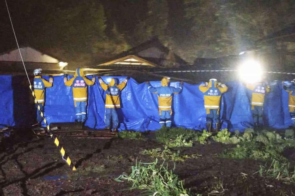 The woman was rescued from a collapsed house in Suzu, Ishikawa prefecture (Kyodo News via AP)