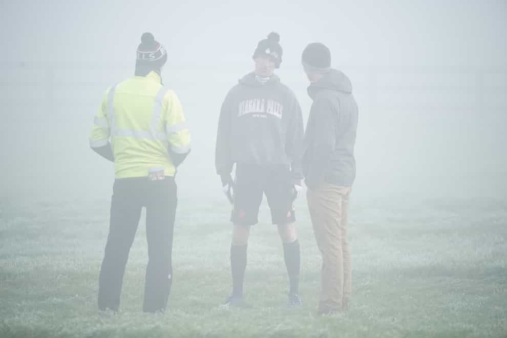 Patrick Mullins chats with course officials at a foggy Naas (Niall Carson/PA)