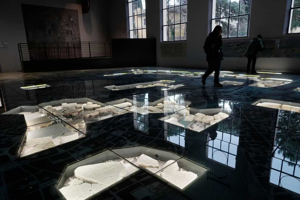 The giant marble map (Forma Urbis Romae) of ancient Rome is shown to the media in the Archaeological Park of Mount Celio Museum overlooking the Colosseum in Rome (Gregorio Borgia/AP)