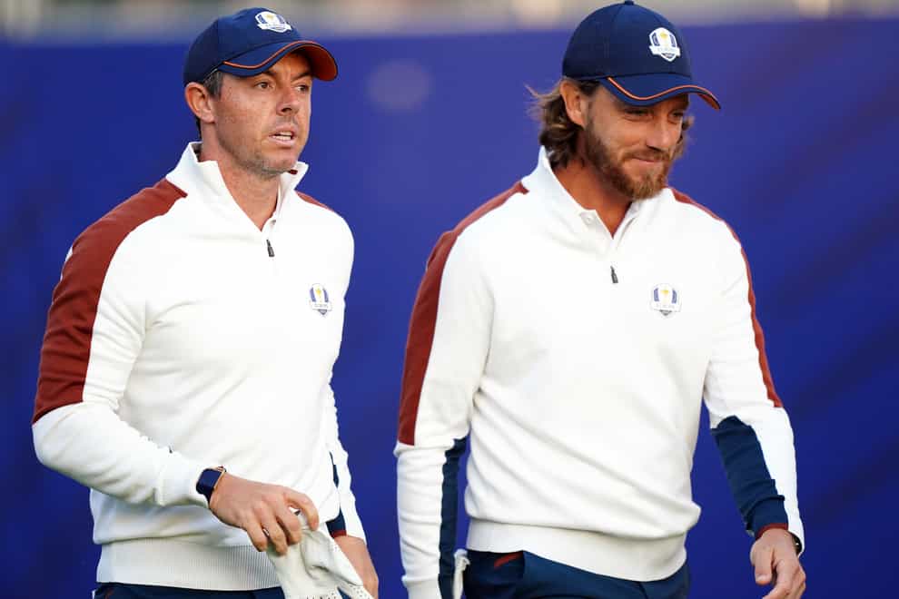 Rory McIlroy, left, is one shot behind Tommy Fleetwood (Zac Goodwin/PA)