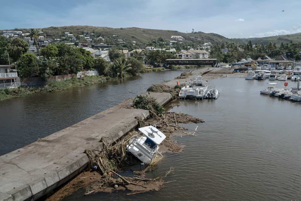 Trees and debris in the marina of Saint-Gilles les Bains on the French Indian Ocean island of Reunion on Tuesday (Lewis Joly/AP)
