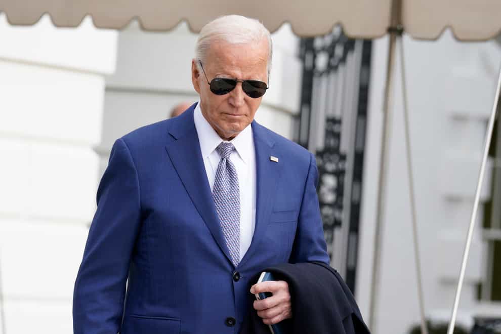 President Joe Biden walks to speak to the media before boarding Marine One on the South Lawn of the White House in Washington (Yuri Gripas/AP)