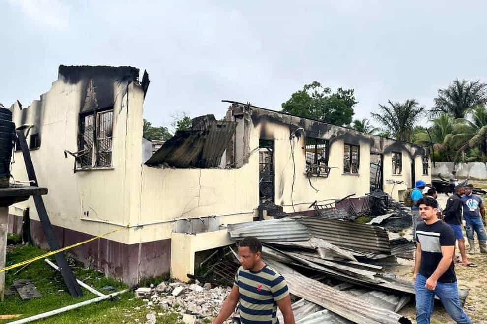 Photo provided by Guyana’s Department of Public Information shows the dormitory after the fire (AP)
