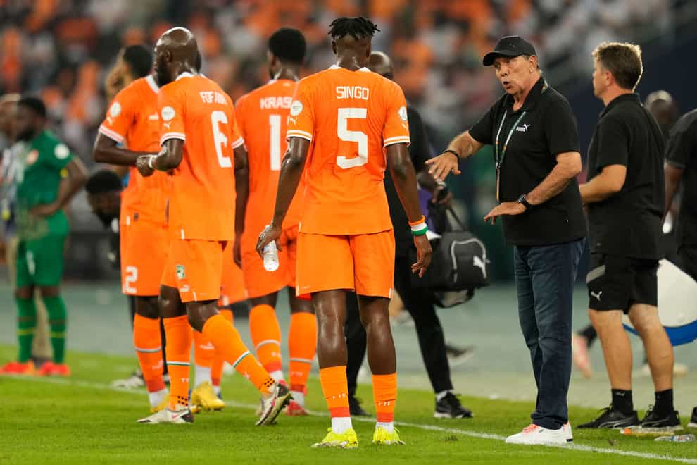 Ivory Coast head coach Jean-Louis Gasset, right, is looking for AFCON hosts Ivory Coast to secure their spot in the knockout rounds (Sunday Alamba/AP)