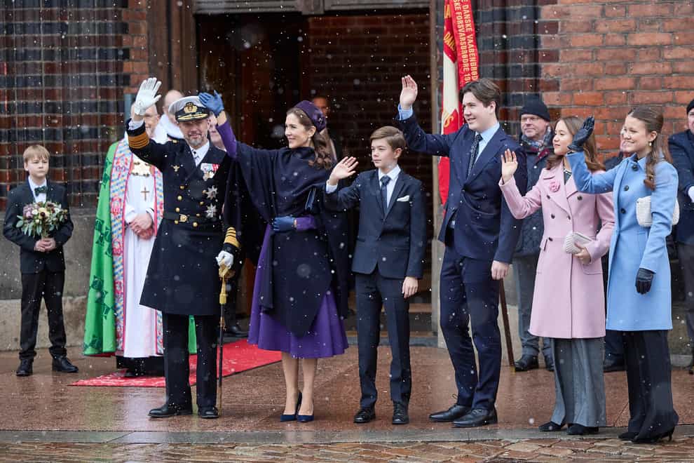 From second left, Denmark’s King Frederik X, Queen Mary, Prince Vincent, Crown Prince Christian, Princess Isabella and Princess Josephine greet the crowd after a service on the occasion of the change of throne in Denmark at Aarhus Cathedral (Mikkel Berg Pederson/Ritzau Scanpix via AP)