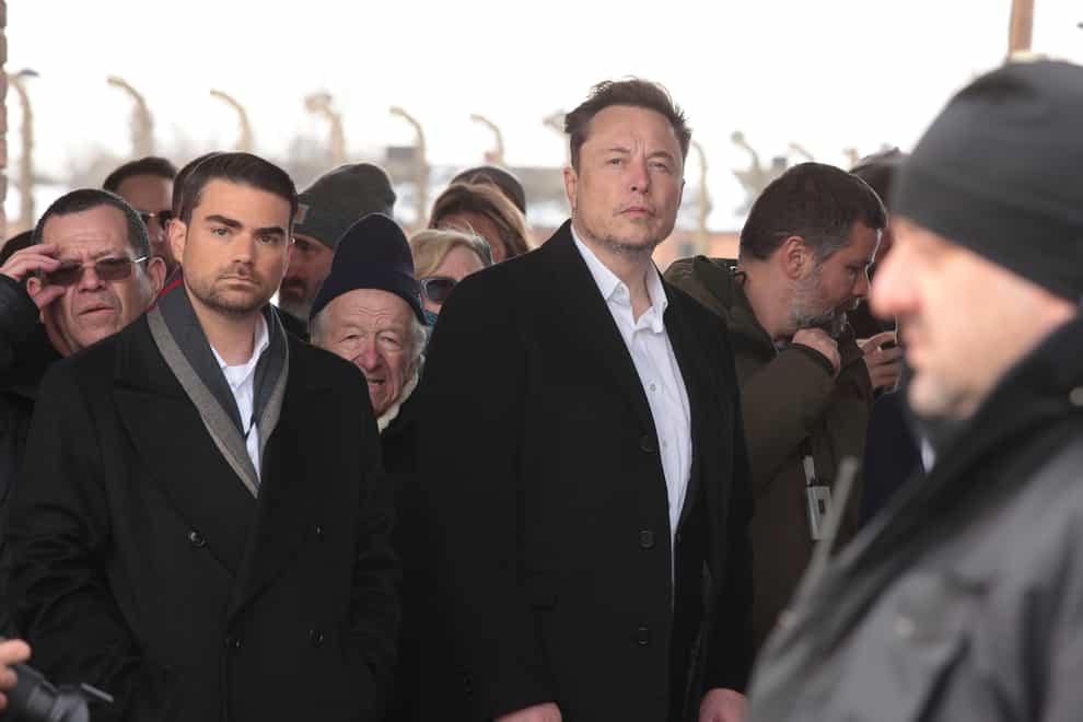 Elon Musk visited the notorious death camp on Monday (AP)