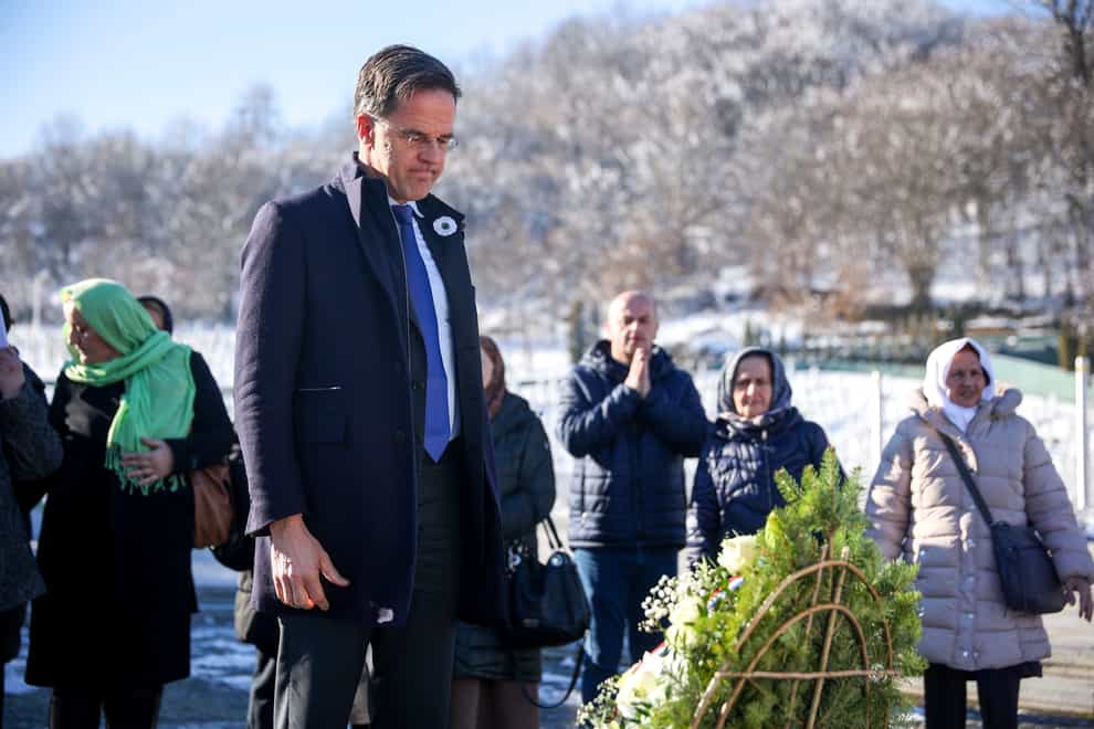 Prime Minister of the Netherlands, Mark Rutte, pays his respects after laying a wreath at the Srebrenica Memorial Center in Potocari, Bosnia, on Monday (Armin Durgut/AP)