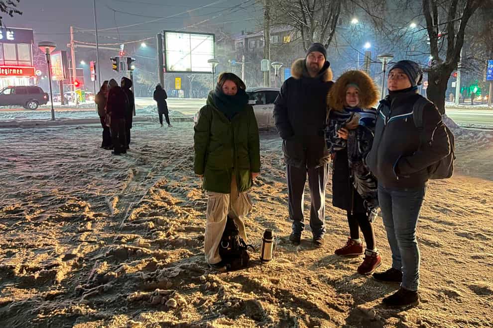 People gather in a street after leaving their flats in Almaty, Kazakhstan, after the earthquake (Vladimir Tretyakov/NUR.KZ via AP)