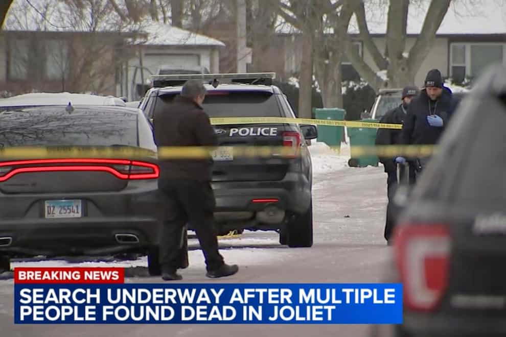 Authorities work a scene in Jolietcafter discovering eight people shot and killed (WLS-TV ABC 7 via AP)