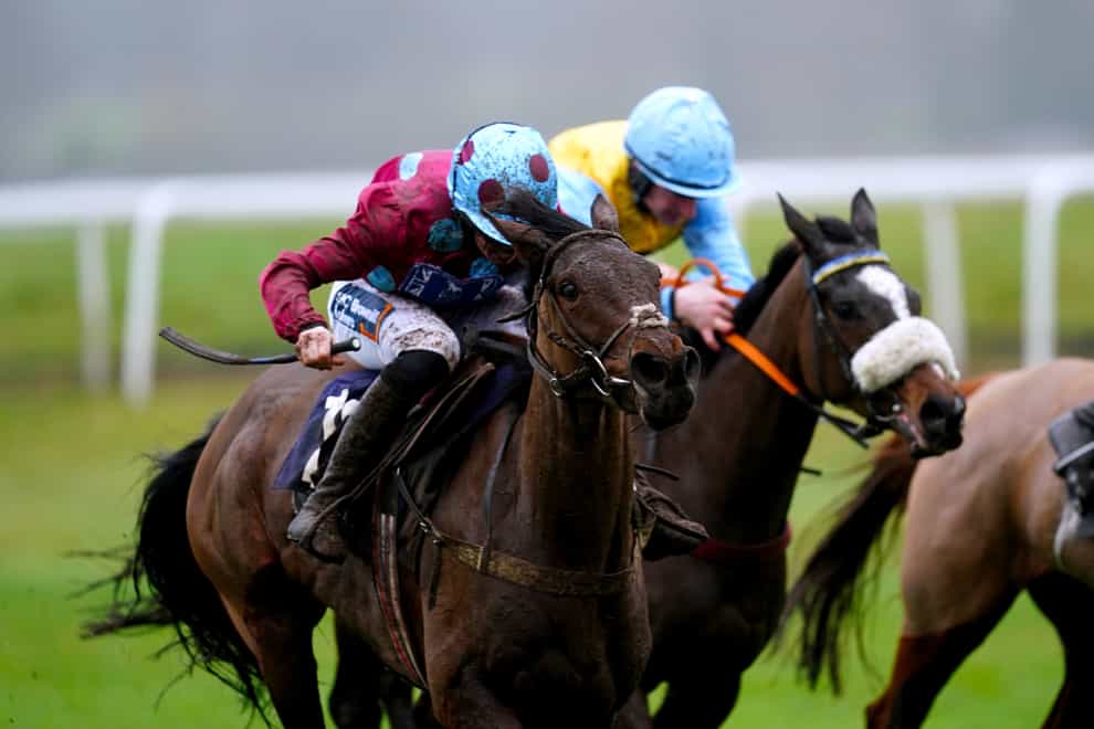 Gaye Legacy ridden by jockey Benjamin Poste (left) on their way to becoming the eventual winner of the Ray Dalfsen Mares’ Handicap Hurdle at Newbury Racecourse, Berkshire. Picture date: Tuesday January 23, 2024.