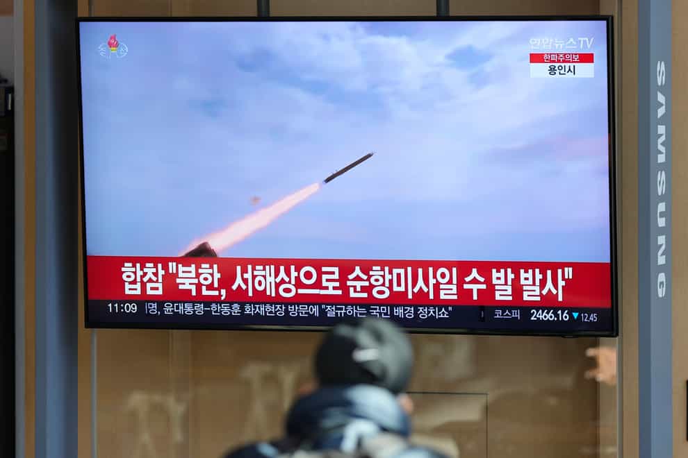 A TV screen shows a report of North Korea’s cruise missiles with file footage during a news programme at the Seoul Railway Station in South Korea (Lee Jin-man/AP)