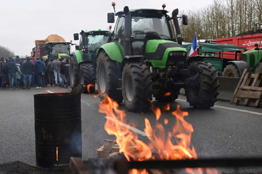 Farmers block a highway during a demonstration near Beauvais, northern France (AP)