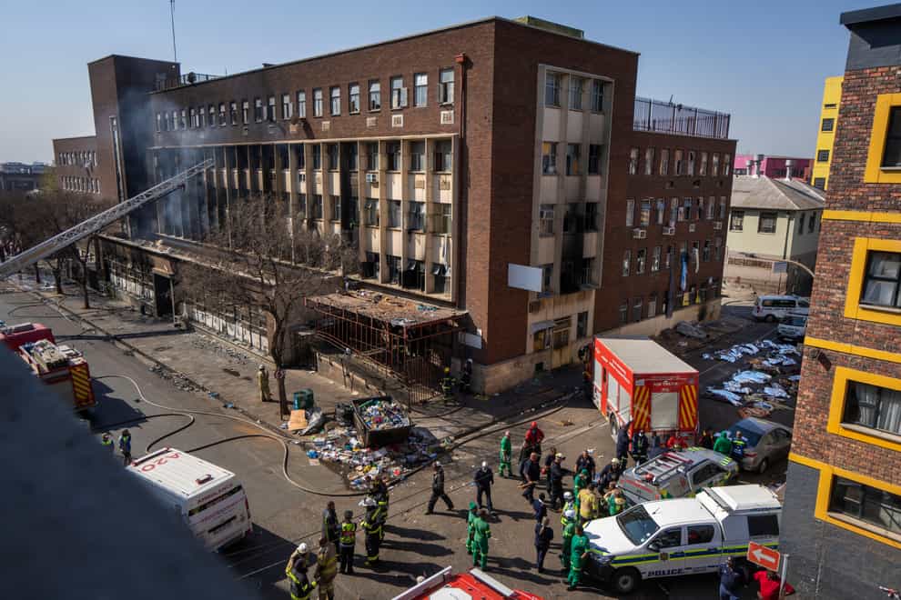 Medics outside the building in downtown Johannesburg where a deadly fire claimed 76 lives (AP Photo/Jerome Delay/File)