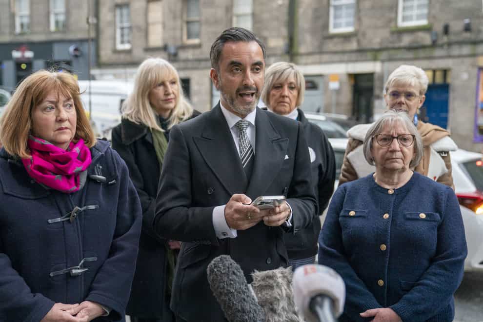 Solicitor Aamer Anwar with members of the Scottish Covid Bereaved Group outside the UK Covid-19 Inquiry hearing at the Edinburgh International Conference Centre (EICC). (Jane Barlow/PA Wire).