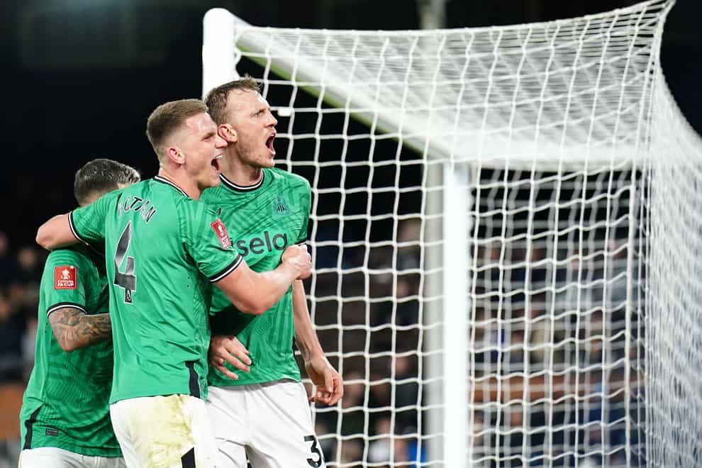 Dan Burn celebrates scoring Newcastle’s second goal (Zac Goodwin/PA)