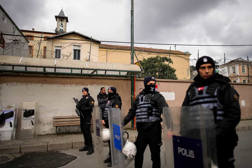 One person was killed when two masked assailants attacked a church in Istanbul during Sunday services, Turkish officials said (Emrah Gurel/AP)