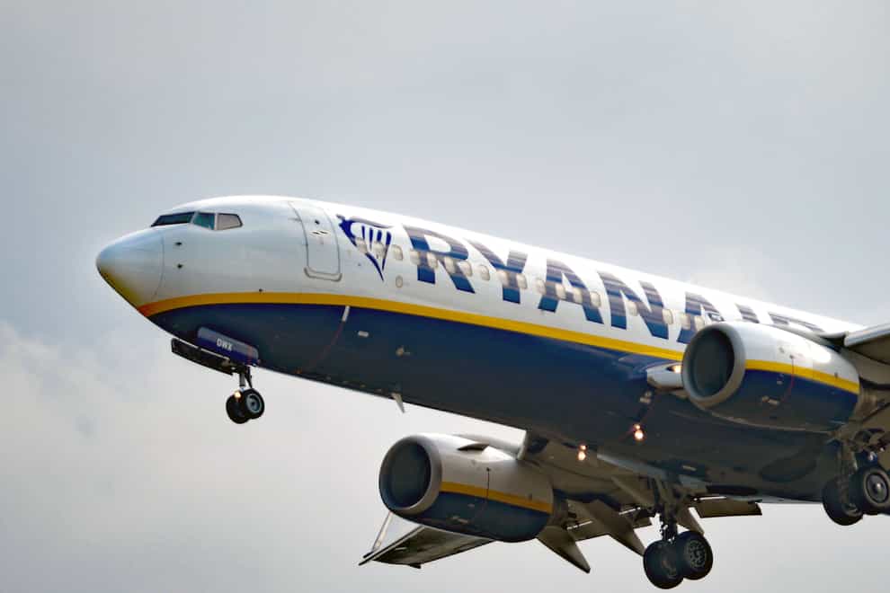 File photo dated 02/09/22 of a Ryanair Boeing 737-8AS passenger airliner comes in to land at Stansted Airport in Essex. Ryanair revealed sharply falling profits following a surge in fuel costs and cut its full-year profit outlook after being removed from some online travel agent websites.
