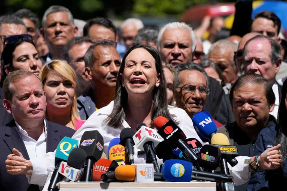 Opposition coalition presidential hopeful Maria Corina Machado gives a press conference outside her campaign headquarters in Caracas, Venezuela, on Monday (Ariana Cubillos/AP)