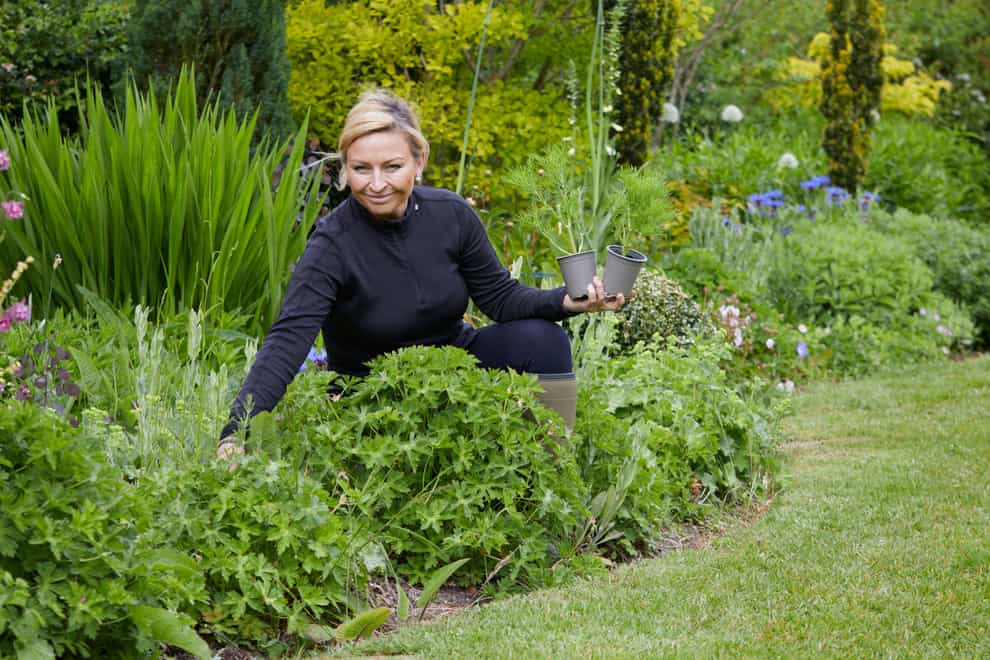 Money-saving gardener Anya Lautenbach in her garden (Britt Willoughby-Dyer/Dorling Kindersley/PA)