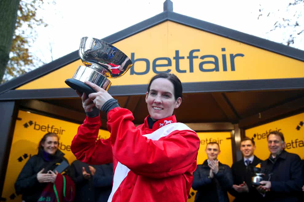 Jockey Rachael Blackmore celebrates with the trophy after winning the Betfair Chase on A Plus Tard (Simon Marper/PA)