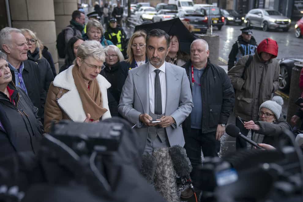 Aamer Anwar, centre, is the solicitor for the Scottish Covid Bereaved (Jane Barlow/PA)