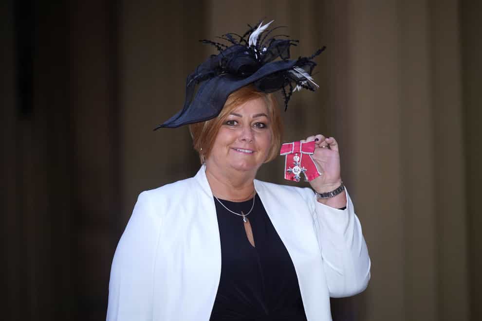 Charity campaigner Suzanne Richards after being made a Member of the Order of the British Empire (PA)