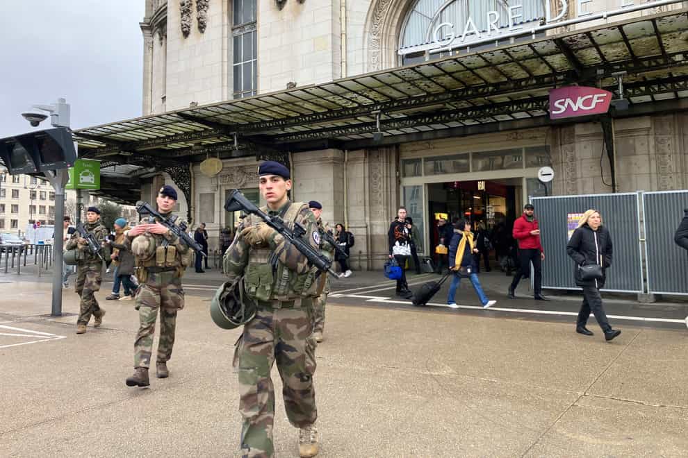 Soldiers patrol outside the Gare de Lyon station (Christophe Ena/AP)