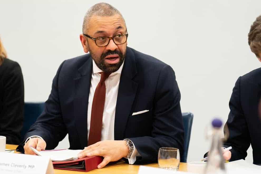 Home Secretary James Cleverly has announced plans to criminalise scaling war memorials (James Manning/PA)