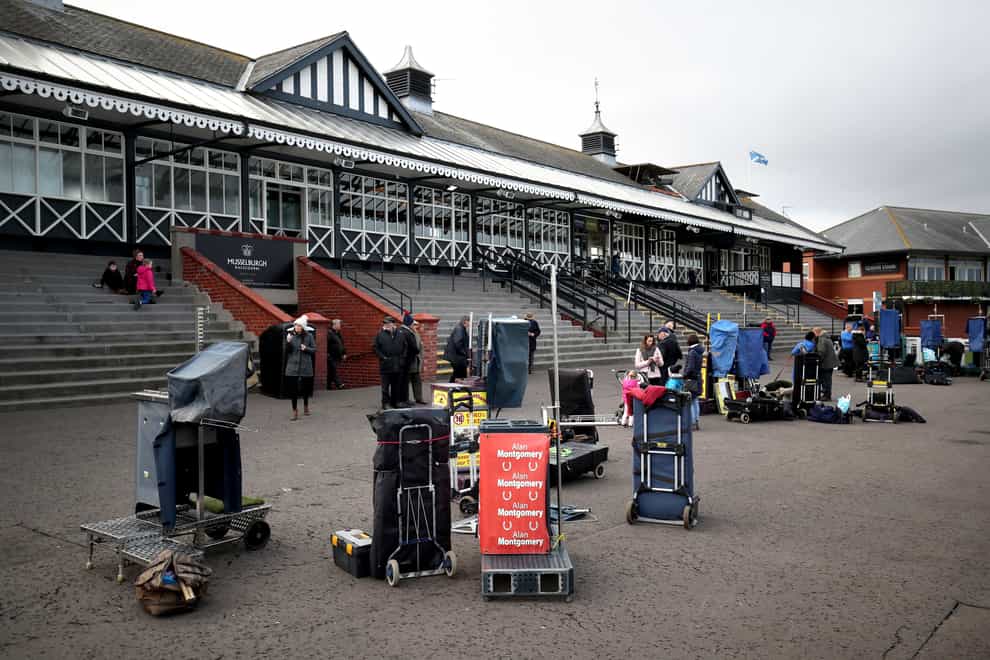 Bookmakers set up their stalls in front of the main stand at Musselburgh Racecourse.