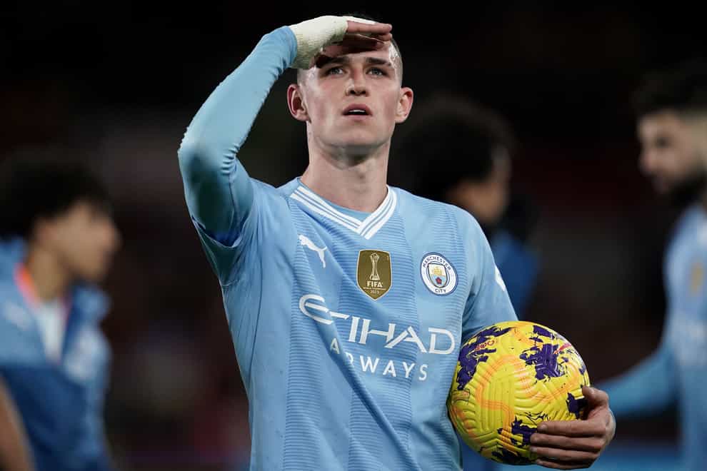 Phil Foden took the match ball after scoring a hat-trick at Brentford (Adam Davy/PA)